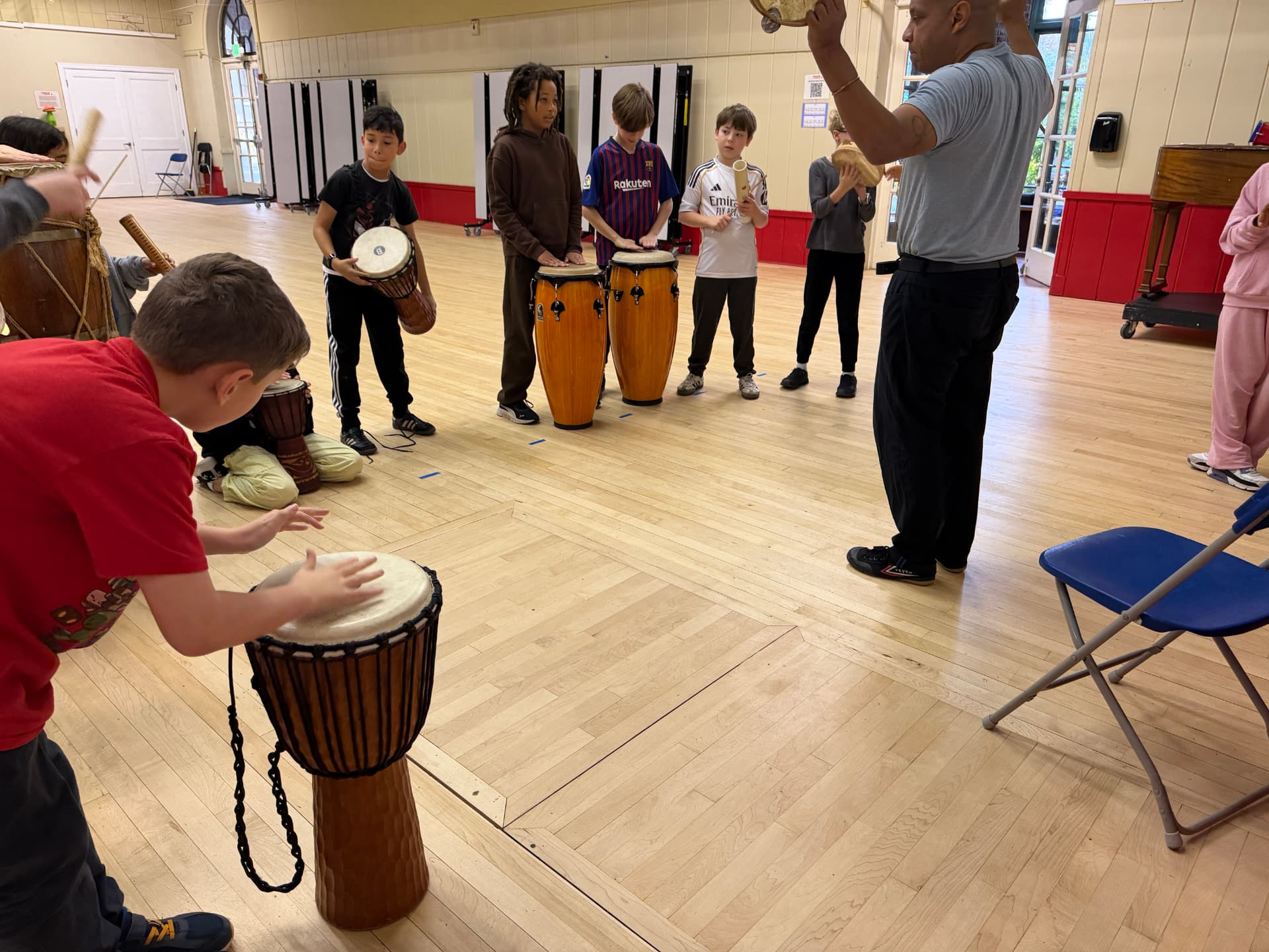 Bright Minds students practicing capoeira movements together