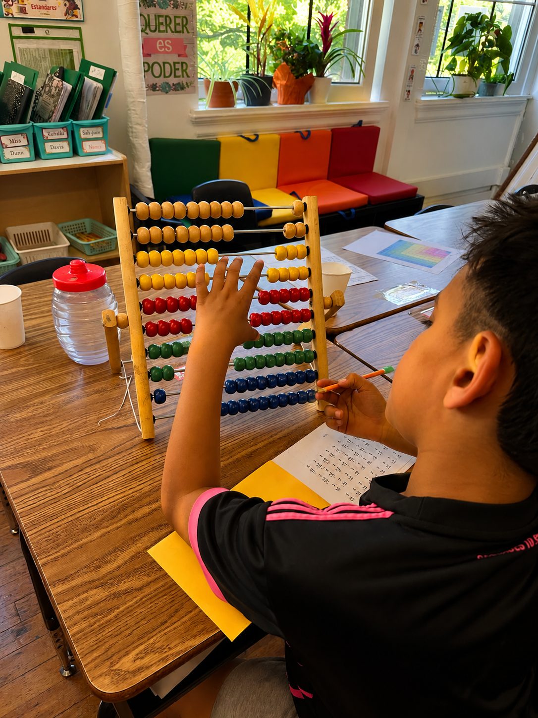 Bright Minds students solving math problems together at a table