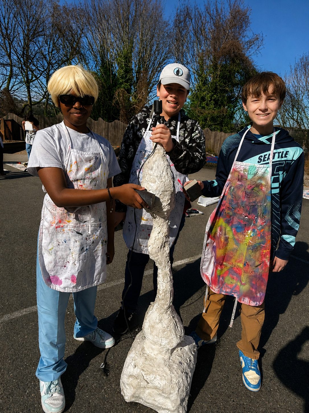 Middle school students working on a studio art and design project