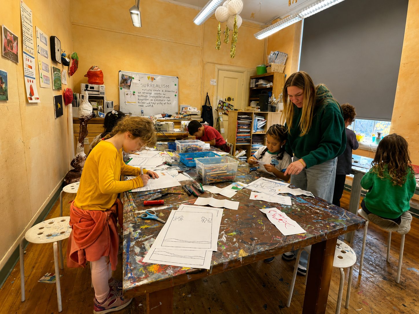 Students painting and making art together at a shared table