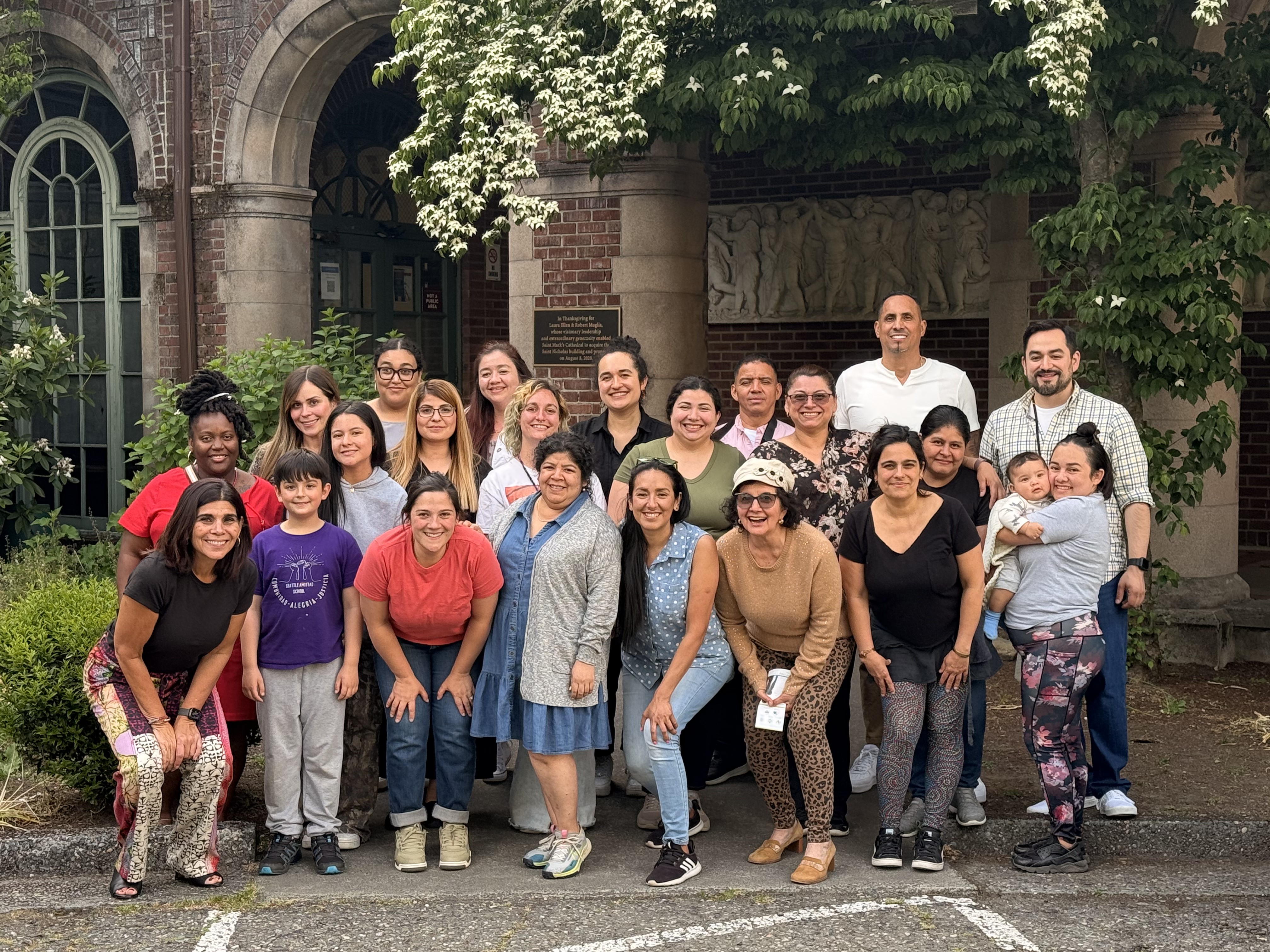 The Seattle Amistad School community of teachers, staff, and families gathered together outside the school entrance