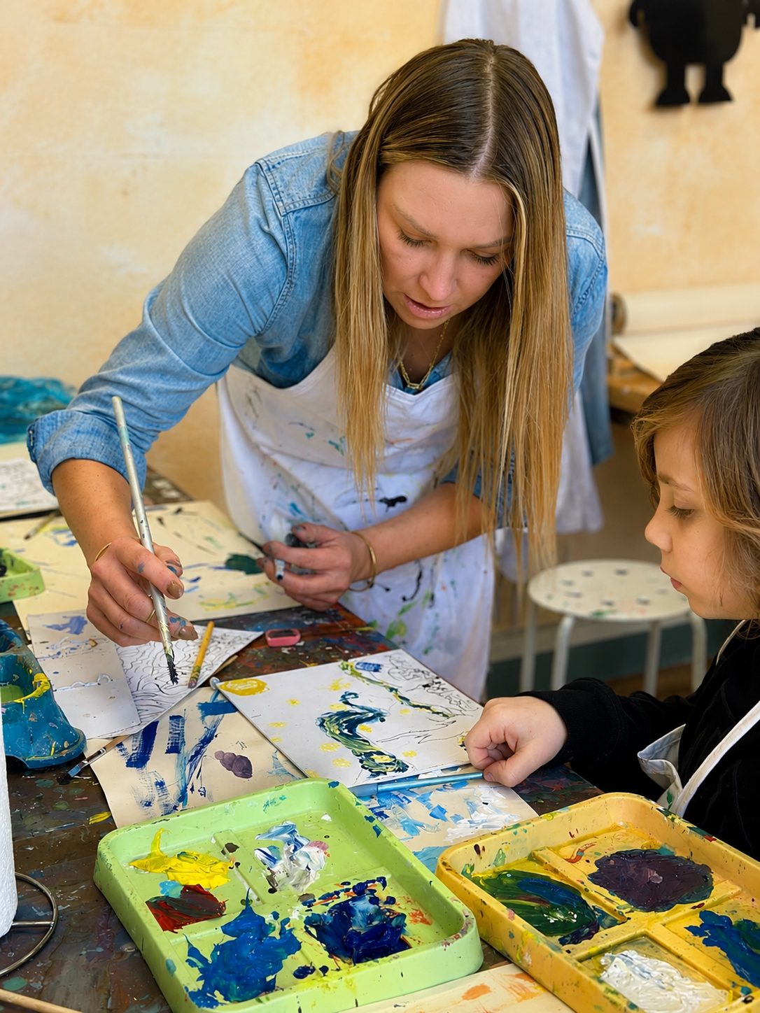 Bright Minds students working on art projects in the studio