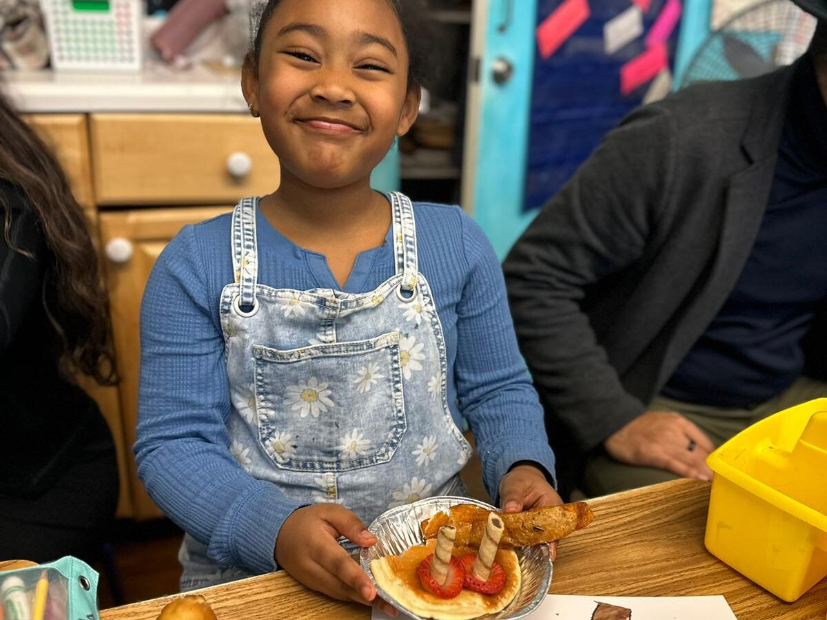 Students making art together at a shared table